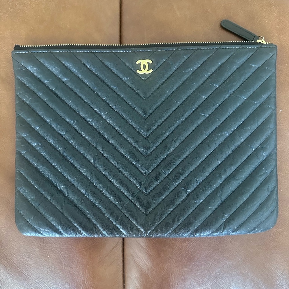 CHANEL Black Chevron Pouch with Gold Accent
